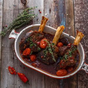 Lamb shank braised in tomato sauce