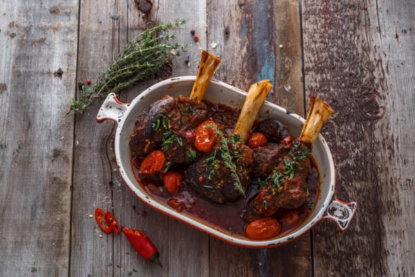 Lamb shank braised in tomato sauce